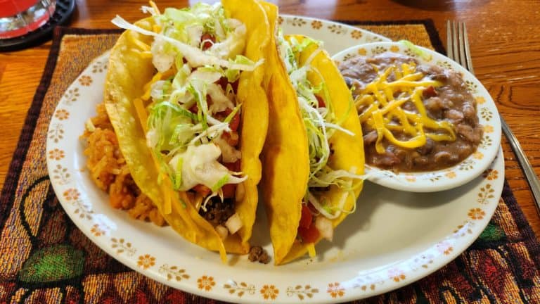 Taco platter with Mexican rice and refried beans